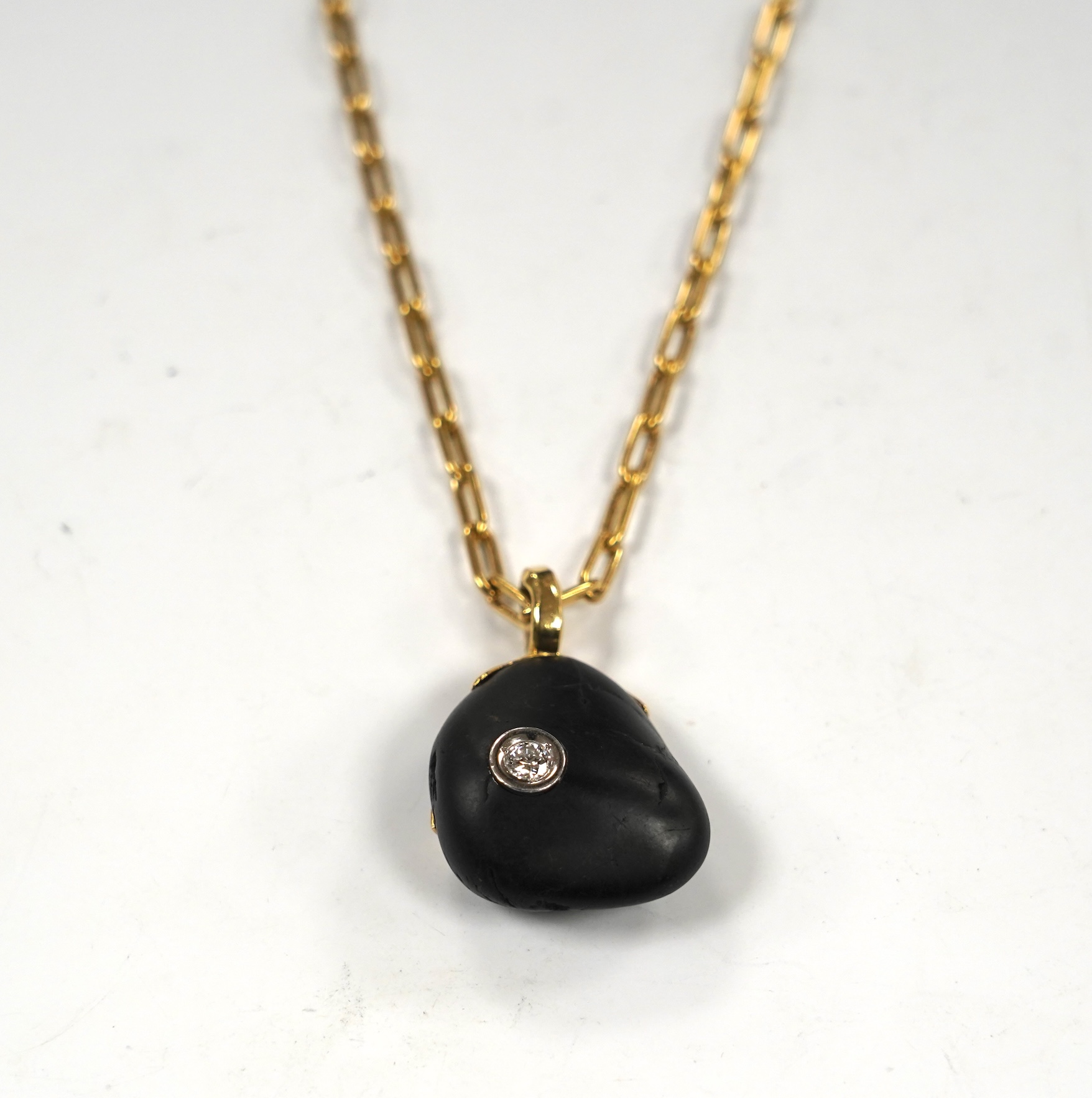 A modern Chou Chou 18k and pt mounted inset diamond pebble? pendant, 38mm overall, on a Chou Chou 18k chain, 62cm, chain weight 27 grams.